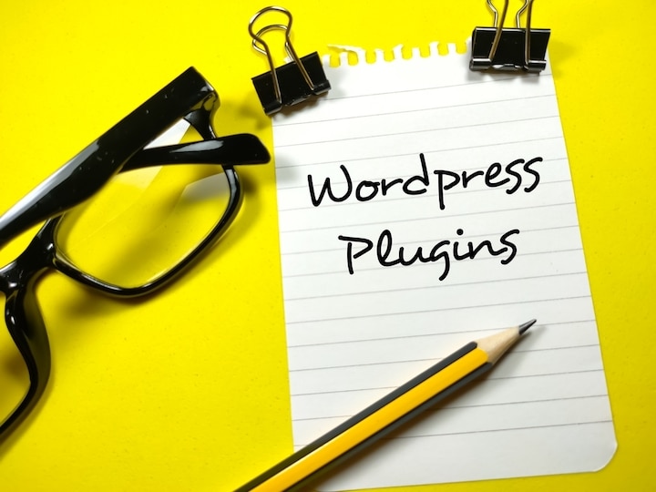 Wordpress Plugins written on a piece of paper